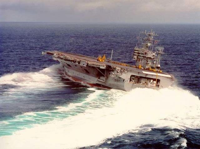 25-4144551-aircraft-carrier-tips-as-it-makes-sharp-turn.jpg